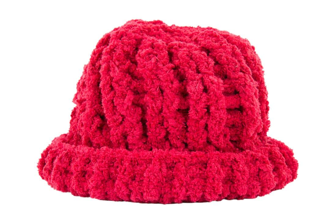 large pink woolen hat on a white background