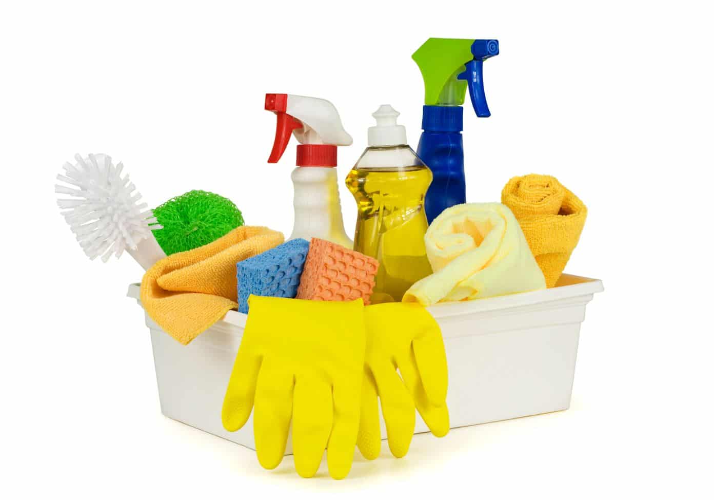 a variety of cleaning utensils in a white caddie on a white background