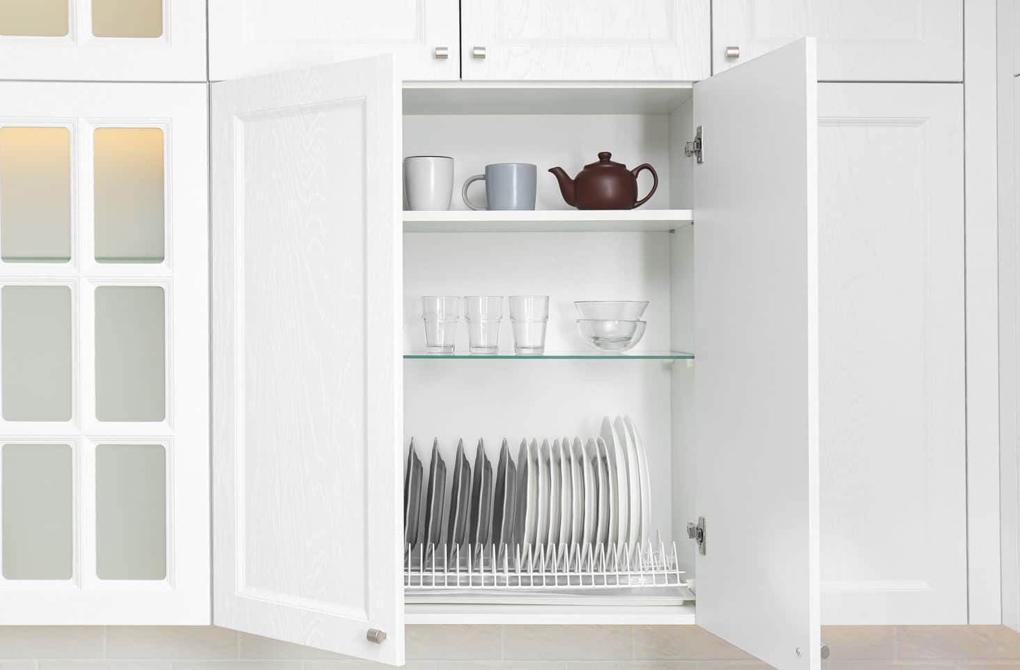 well organised pantry with cutlery in a white kitchen cupboard