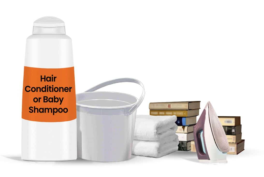 iron, towl, bucket and other tools needed to unshrink clothes on a white background