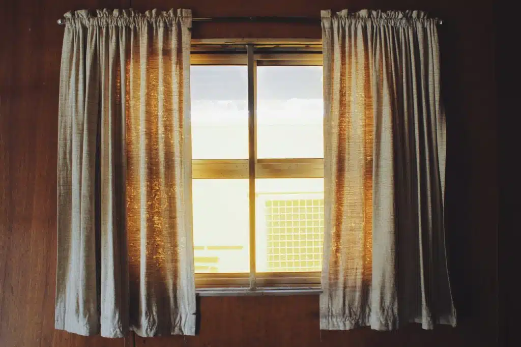 Two white rod pocket curtains