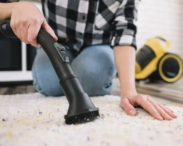 adult-vacuuming-carpet