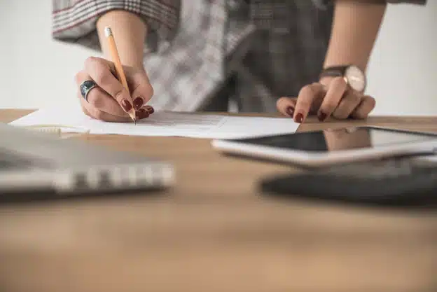 crop-woman-writing-paper