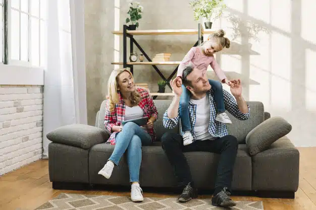 happy-family-sitting-sofa-living-room