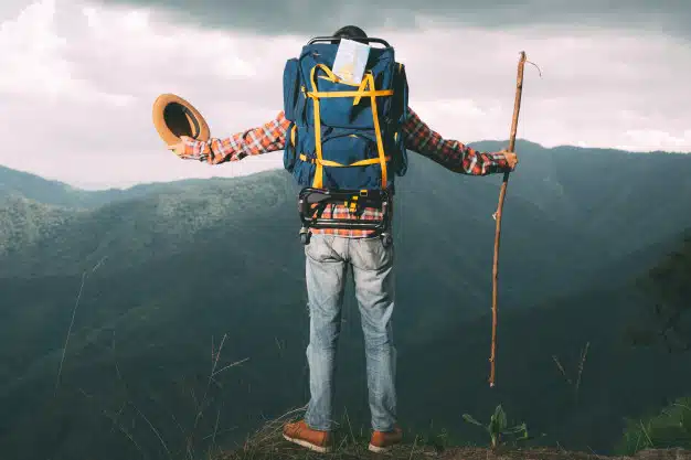 Men stand watching mountain tropical forest