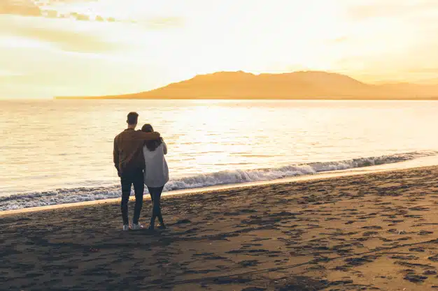 Couple hugging sea shore