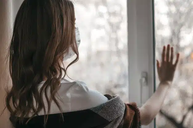 Woman closing window
