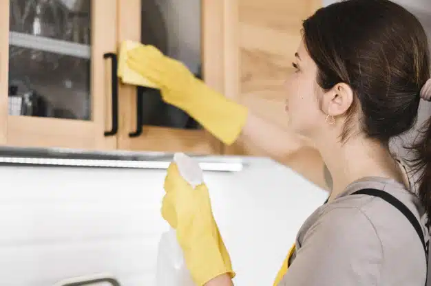 Women cleaning cabinet
