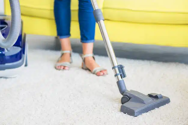 Vacuuming carpet