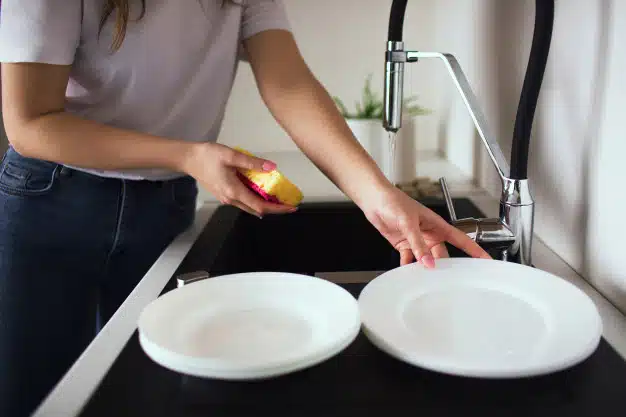 Woman dishwasher cleaning