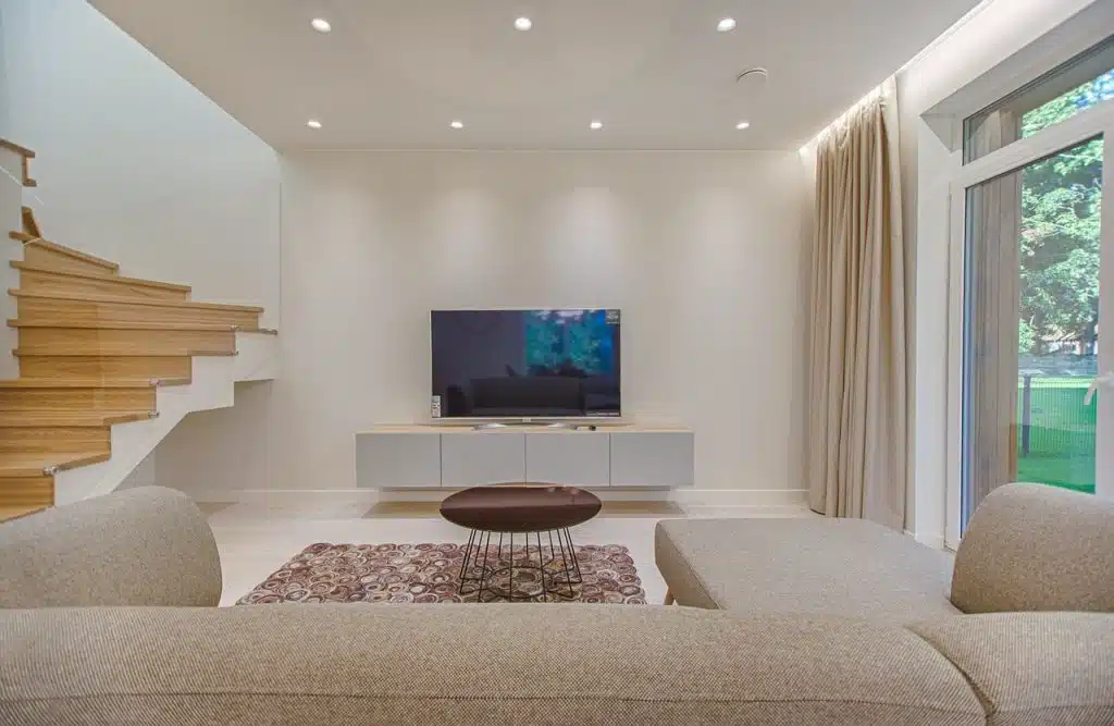 Large flat screen tv in a well designed living room