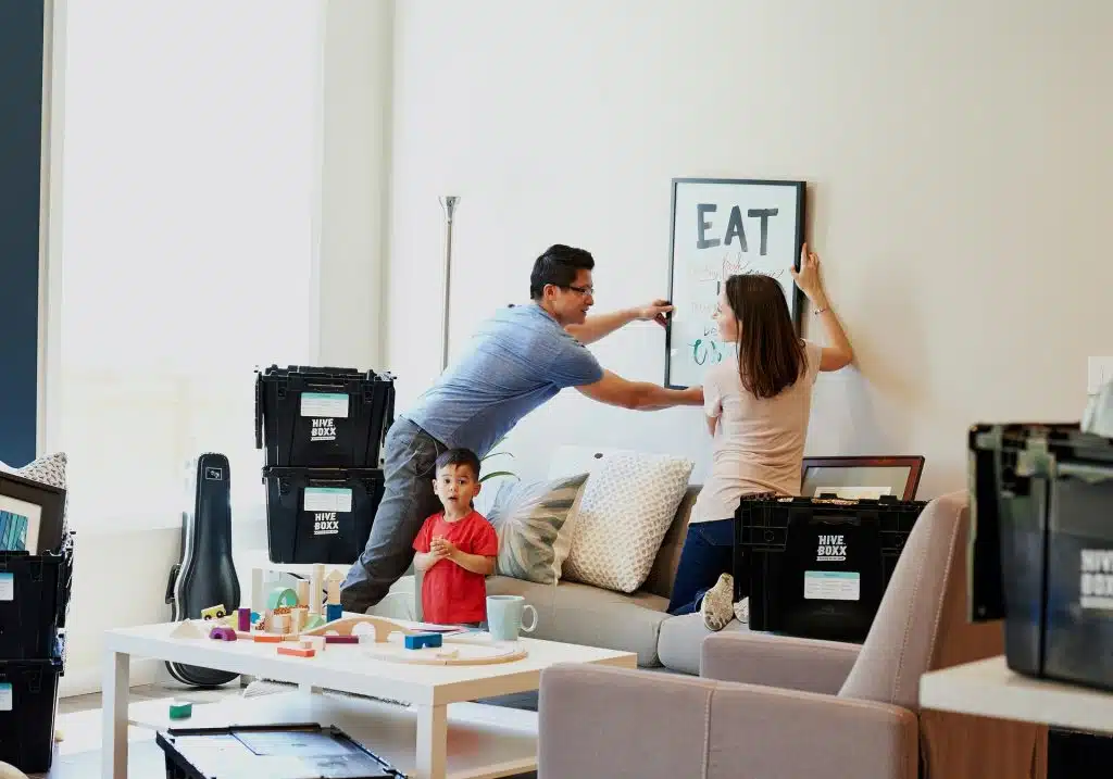 Couple and child getting the frames