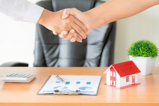 Shaking hands after signed contract