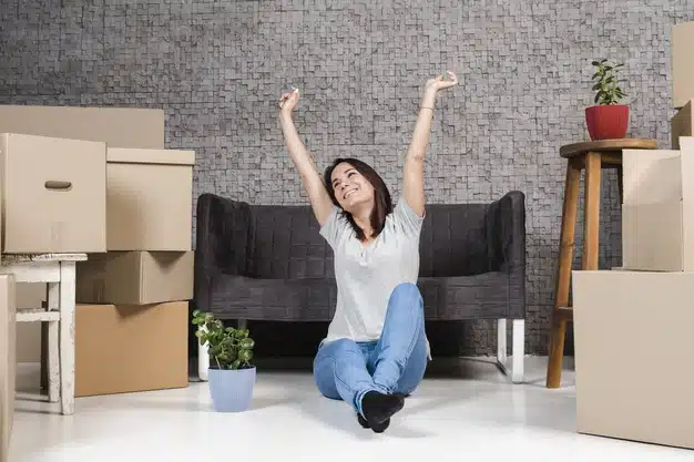 Portrait a young women celebrating to relocate