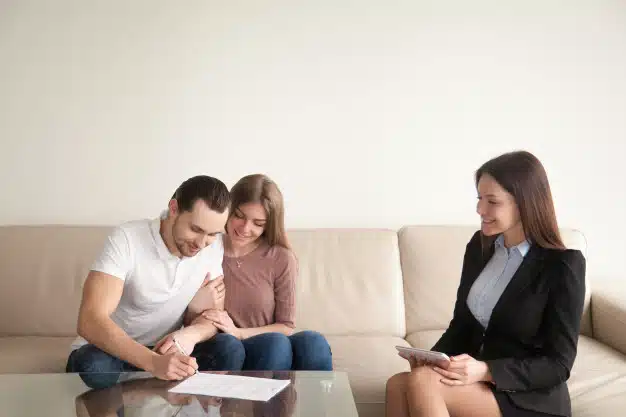 Signing papers to a realtor