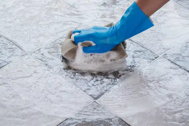 Using sponge for cleaning tiles