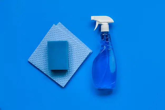 transparent-blue-sprayer-with-window-cleaner