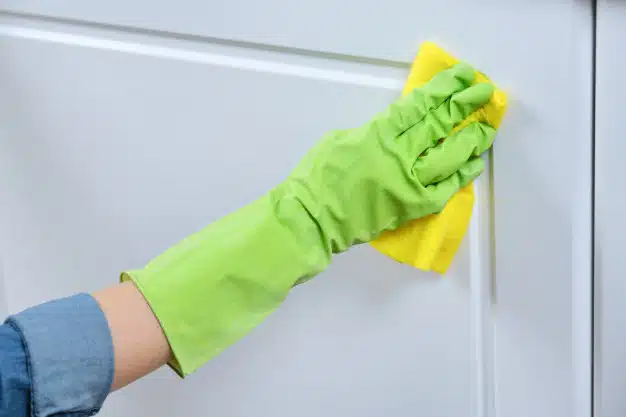 woman-gloves-with-rag-washing-cleaning-polishing-furniture-doors