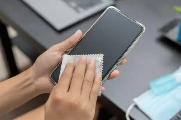 woman hands is wiped clean mobile phone