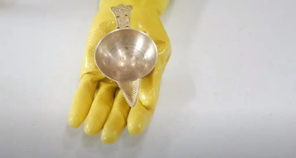 A brass dish after it has been cleaned