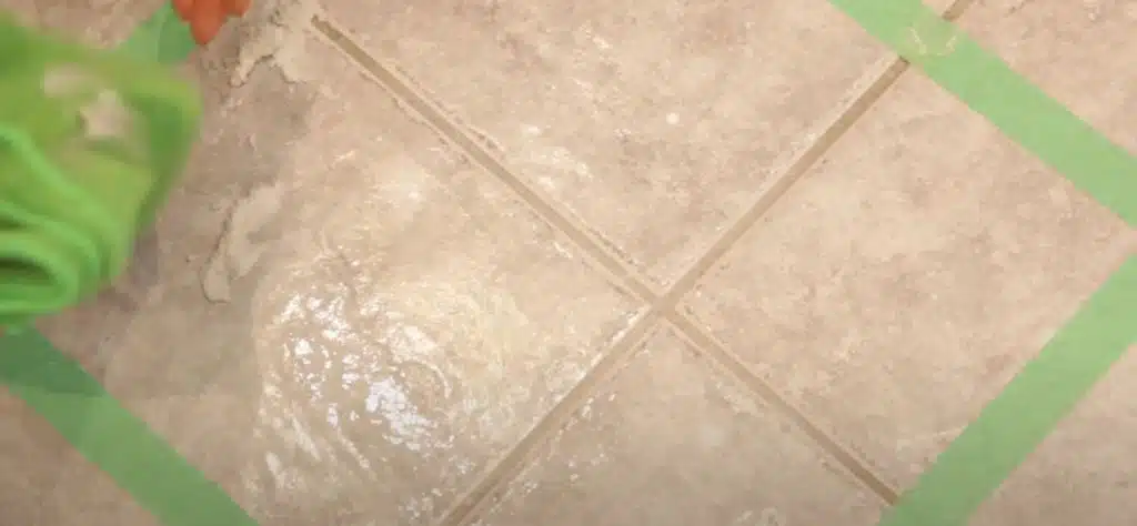 grout cleaning on a white porcelain tiled floor