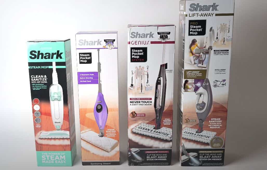4 different steam mop boxes standing upright