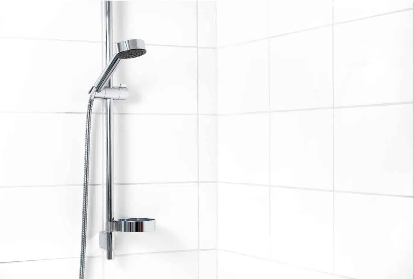 Modern shower with white wall tiles. Simple stylish Scandinavian home interior design.