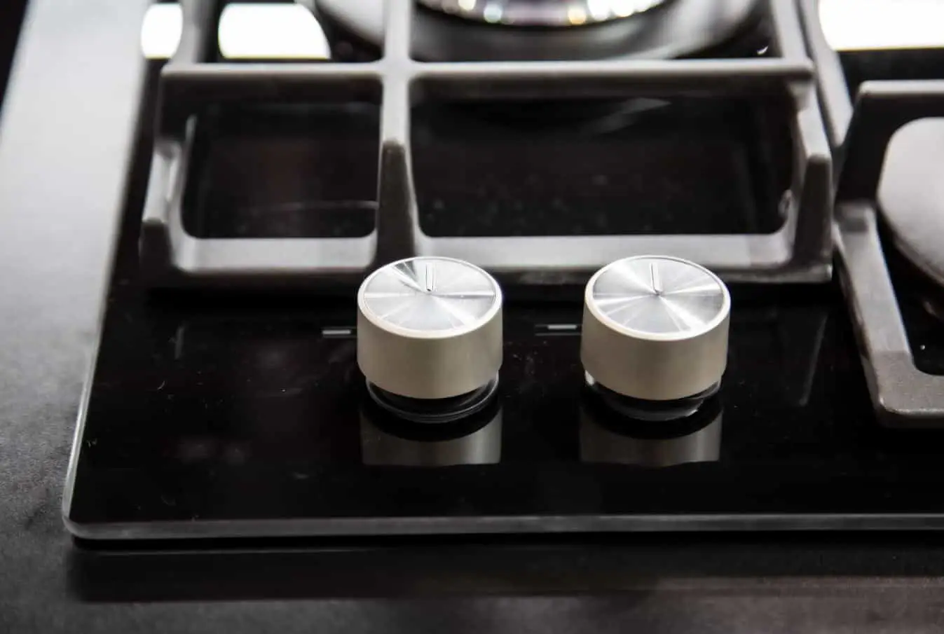 stove top kobs on a black matte stove top