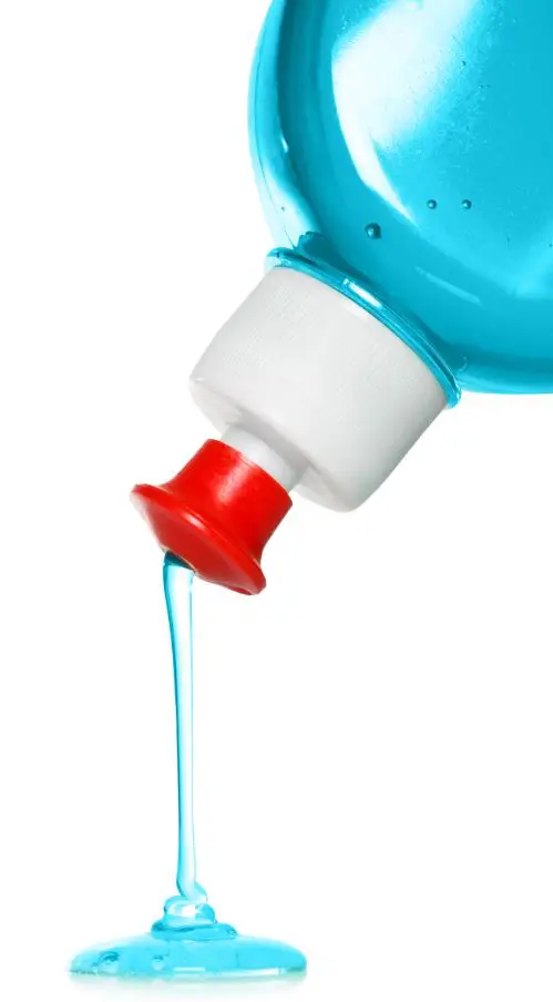 blue dishwashing soap solution in a squeeze bottle