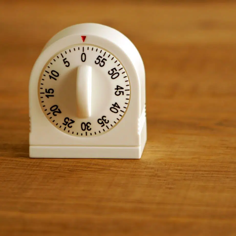 egg timer on a wooden bench