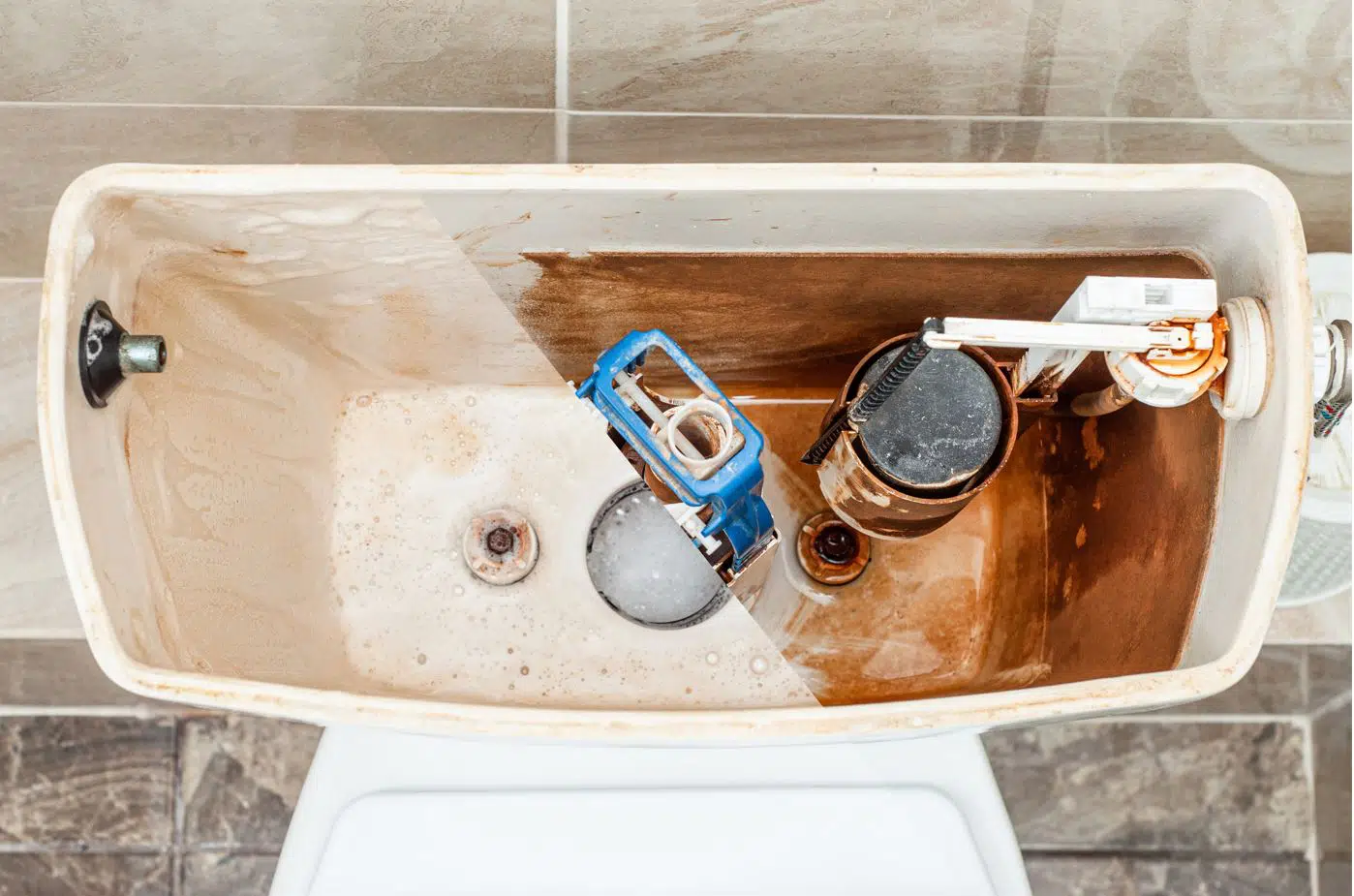 Before and after contrast of a toilet tank that has been thorougly cleaned