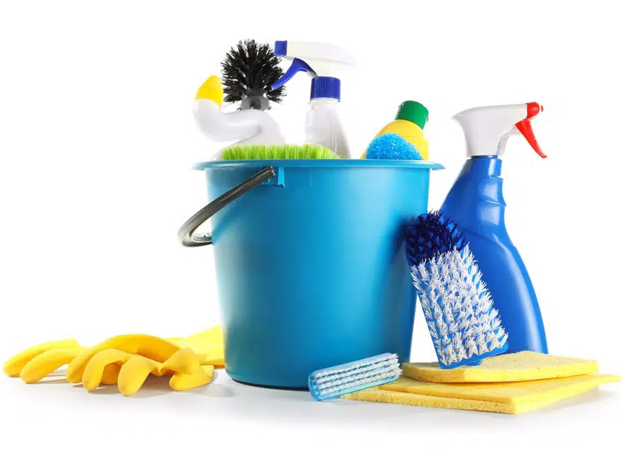 assorted bathroom cleaning products in a blue bucket
