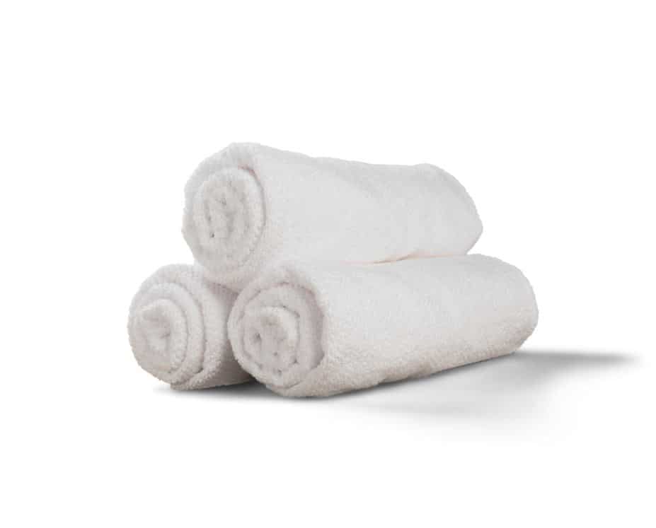 three white towels folded cylindrically on top of each other