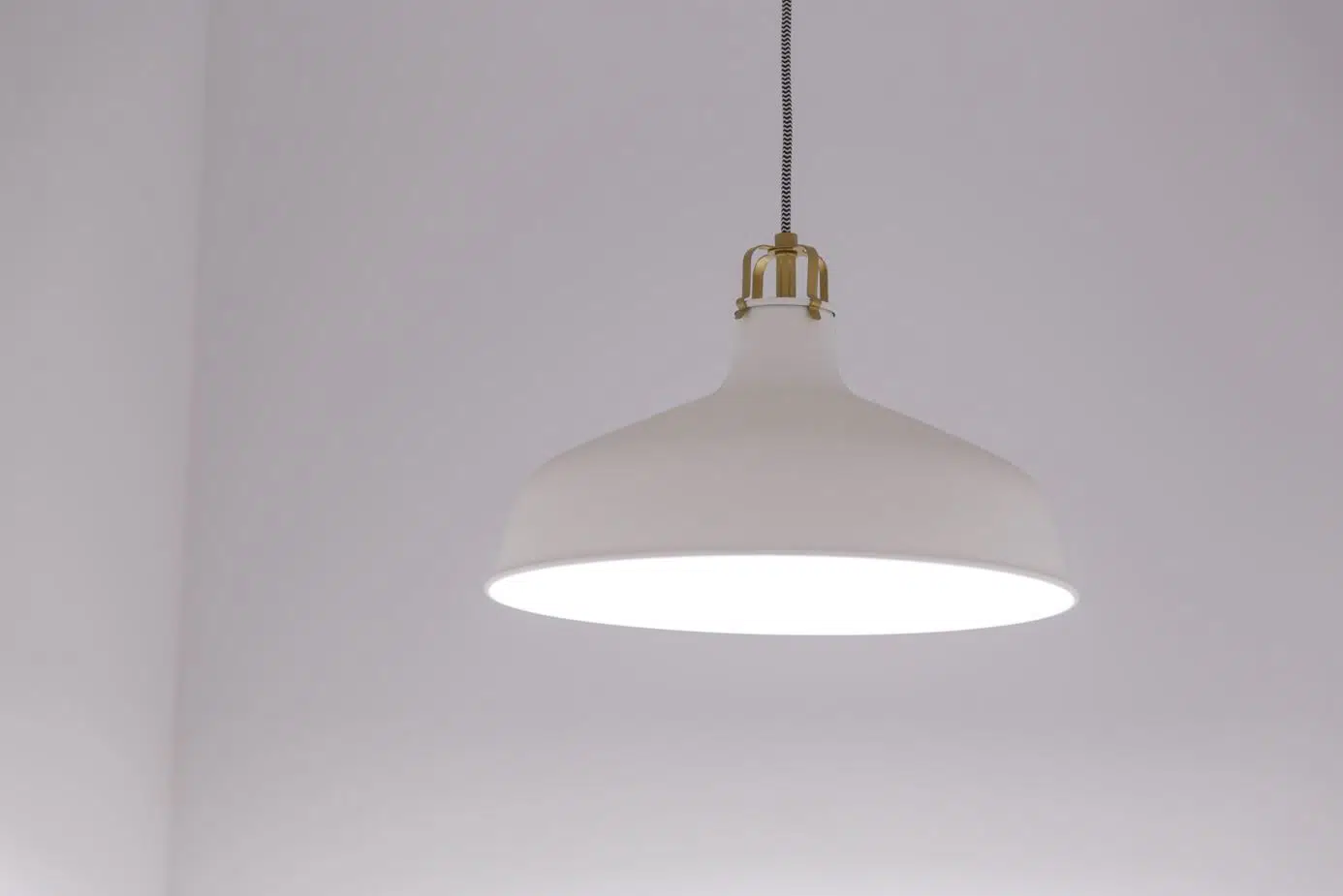 white light fixture against the backdrop of a white wall