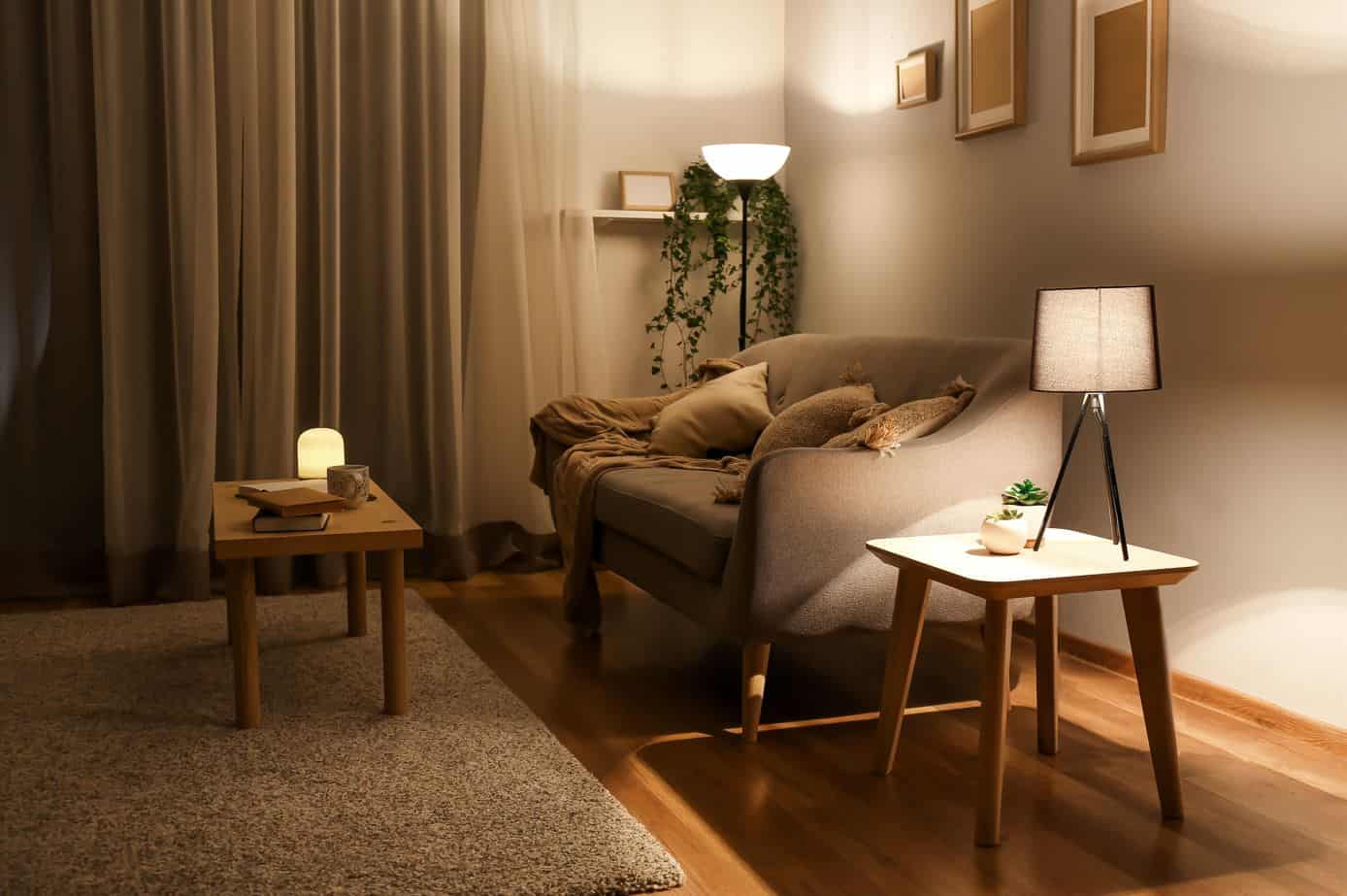 modern wood coloured living room with large grey sofa