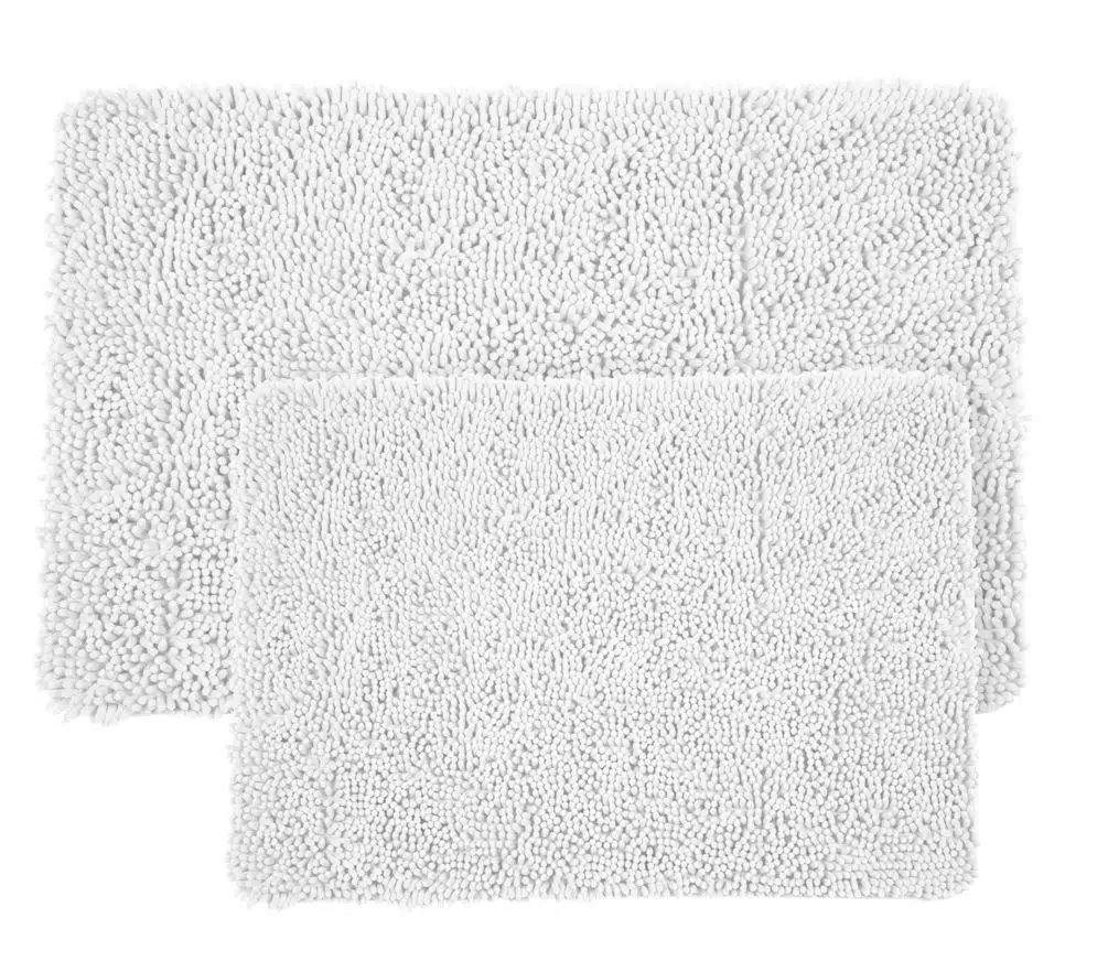 two white cotton fluffy bath mats on a white background