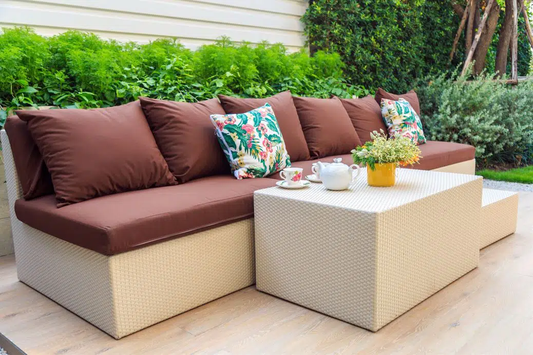 front view of 3 seater outside couch with large brown cushions