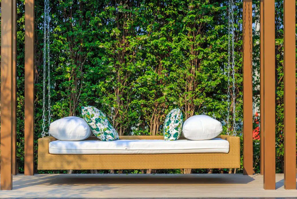hanging outside lounge with large white cushions