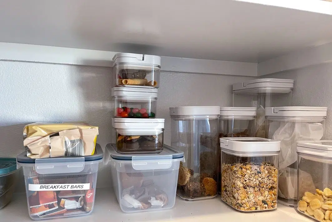 assorted cereal that has been organised into individual plastic containers that are labelled