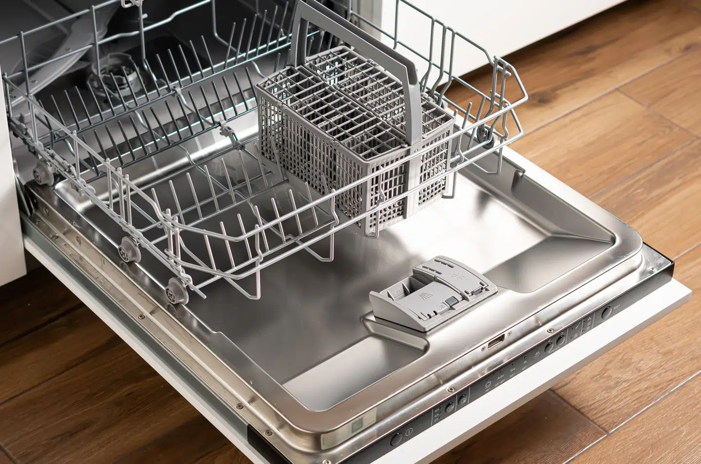 empty dishwasher with opened door in a modern kitchen