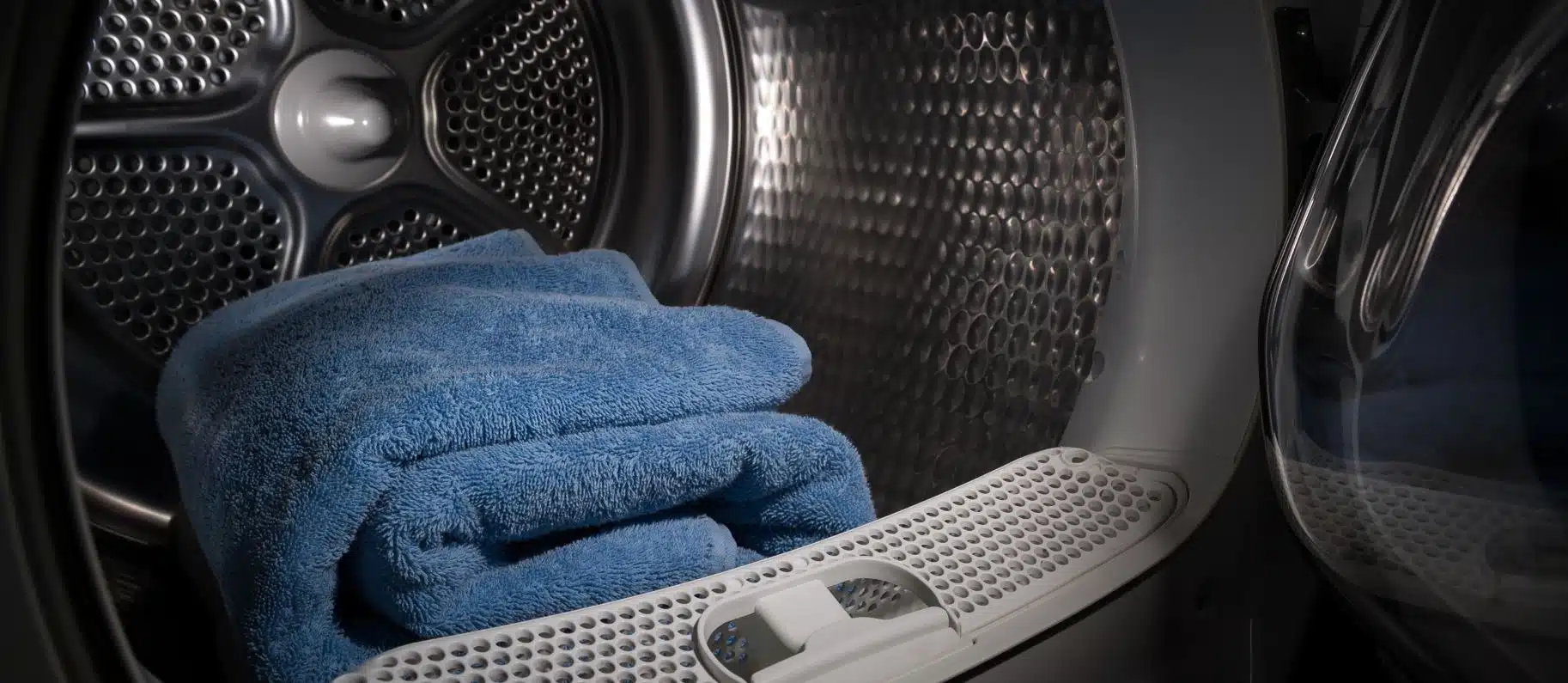 blue towel sitting in tumble dryer