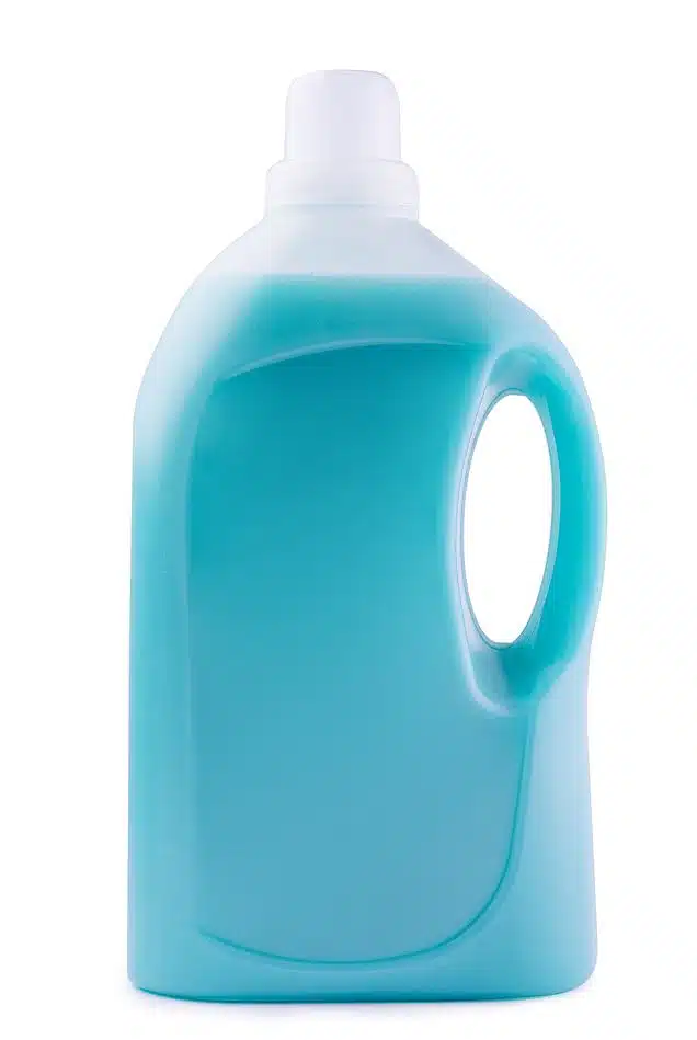 large bottle of blue laundry detergent on a white background
