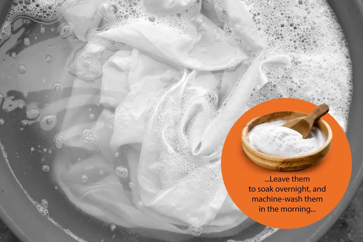 white clothes being washed in a basin with water and baking soda