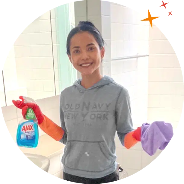 MaidForYou cleaner wearing grey hoodie and gloves Mew holding a bottle of Ajax spray