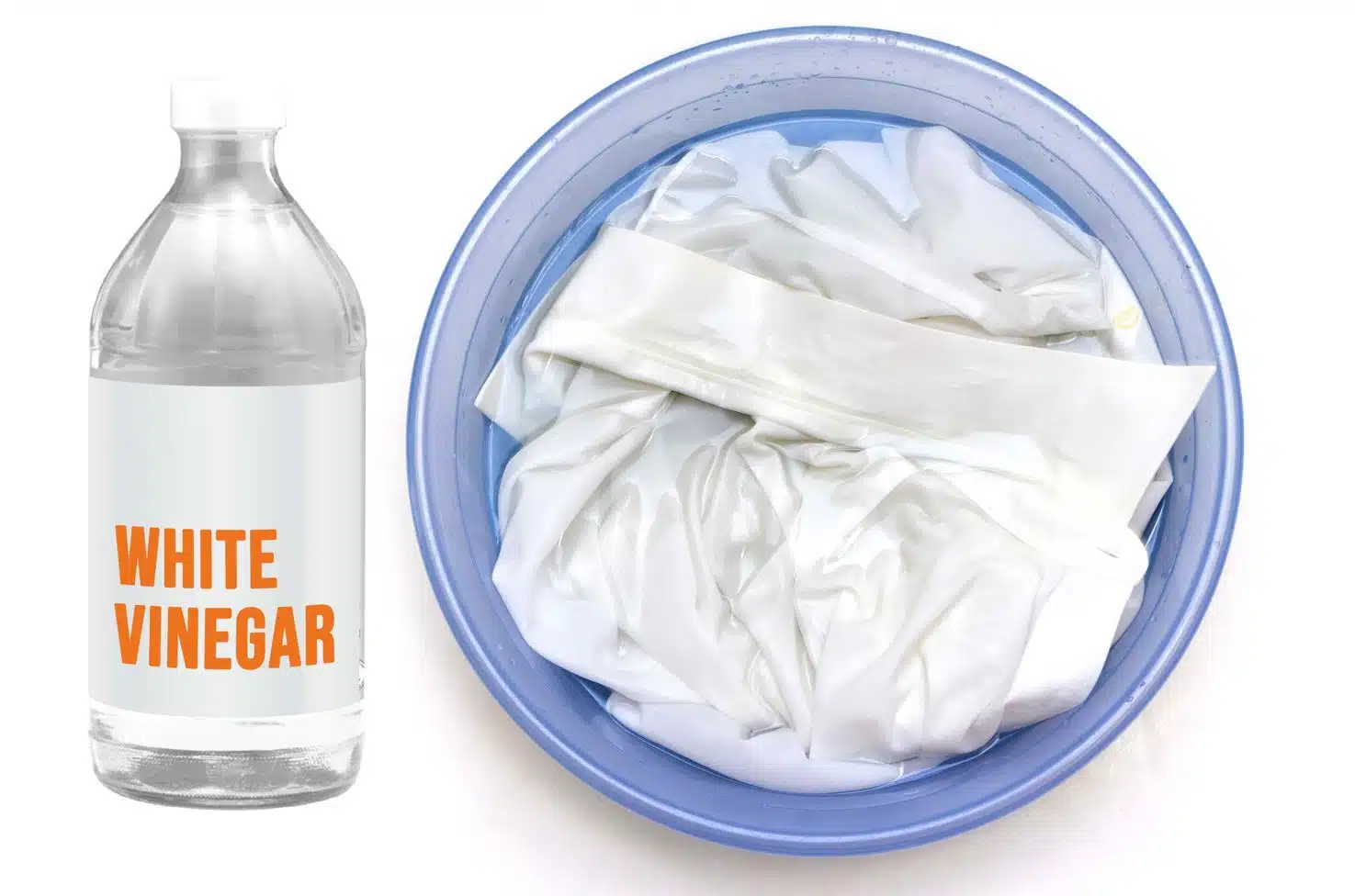 bottle of white vinegar next to a white pressed shirt being hand washed in a blue basin