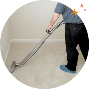 MaidForYou carpet cleaner Peter using a wand to steam clean beige carpets
