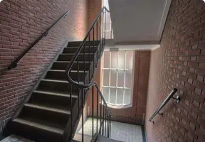 Internal Common Areas Internal stair well of an old red brick Sydney apartment block