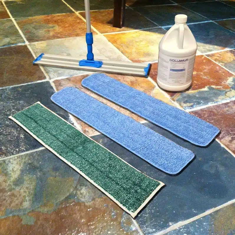 cleaning tools and equipment on a clean slate tiled floor
