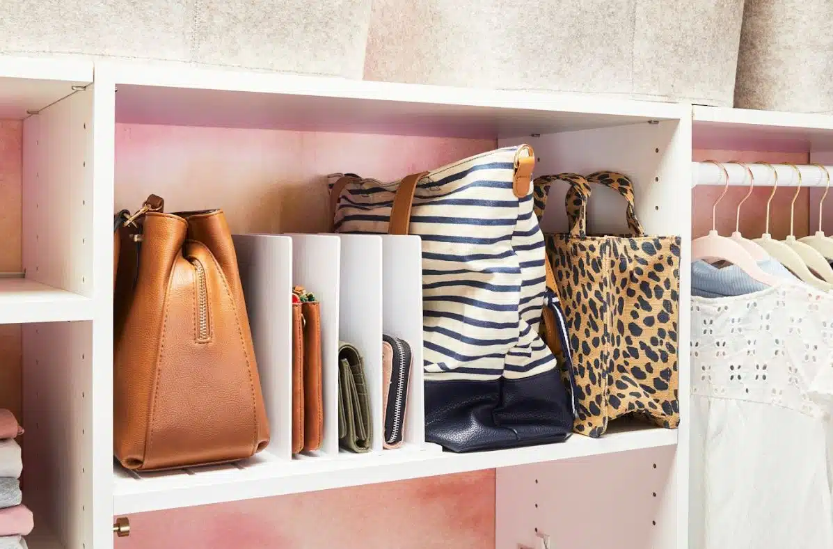 assorted handbags stored in an open shelf
