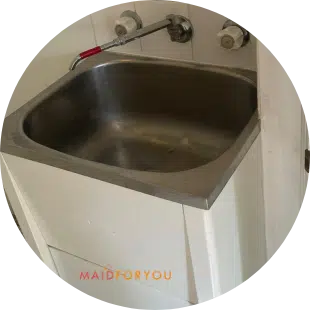 large dated laundry sink after end of lease cleaning